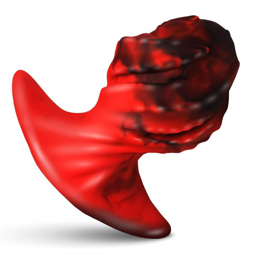 A red dragon-spawn egg-shaped butt plug with twisted black ridges and a flared base, made from smooth silicone.