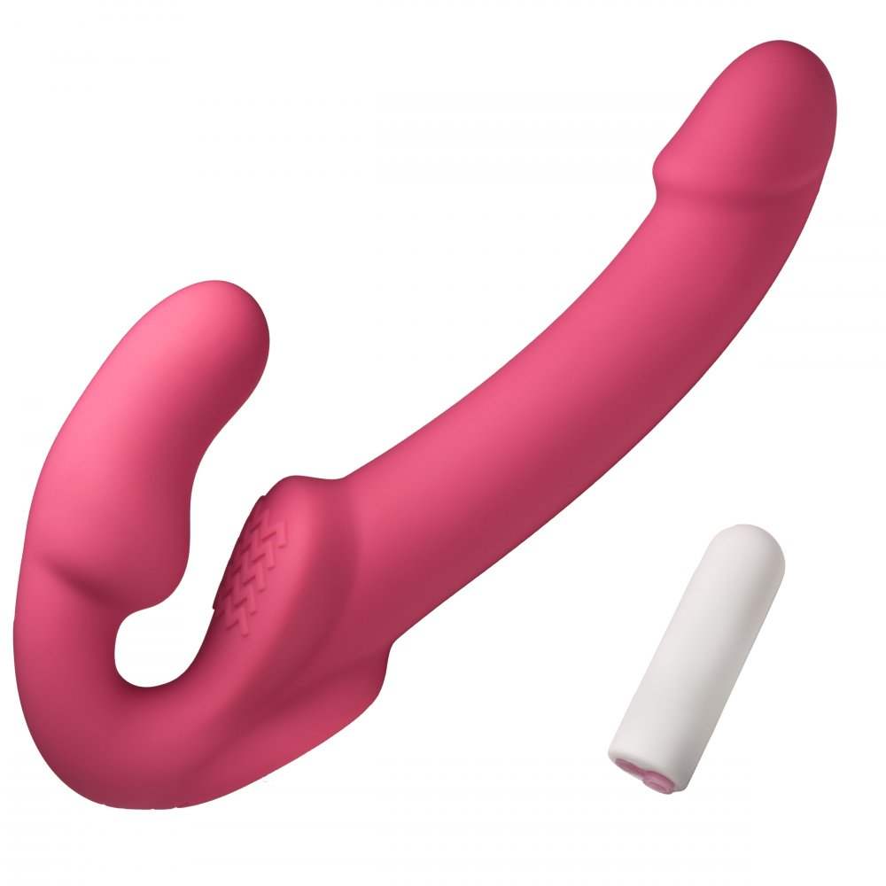 A pink, strapless vibrating dildo with a curved design and a textured clitoral pad, shown alongside a removable white bullet vibrator.